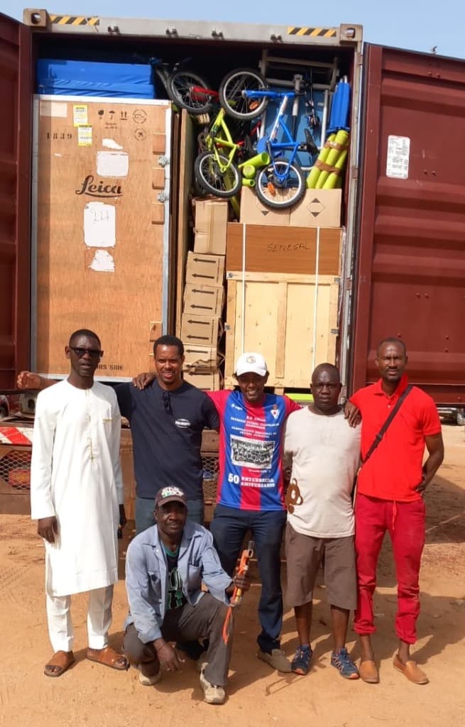 Volunteers packing a container with medical supplies