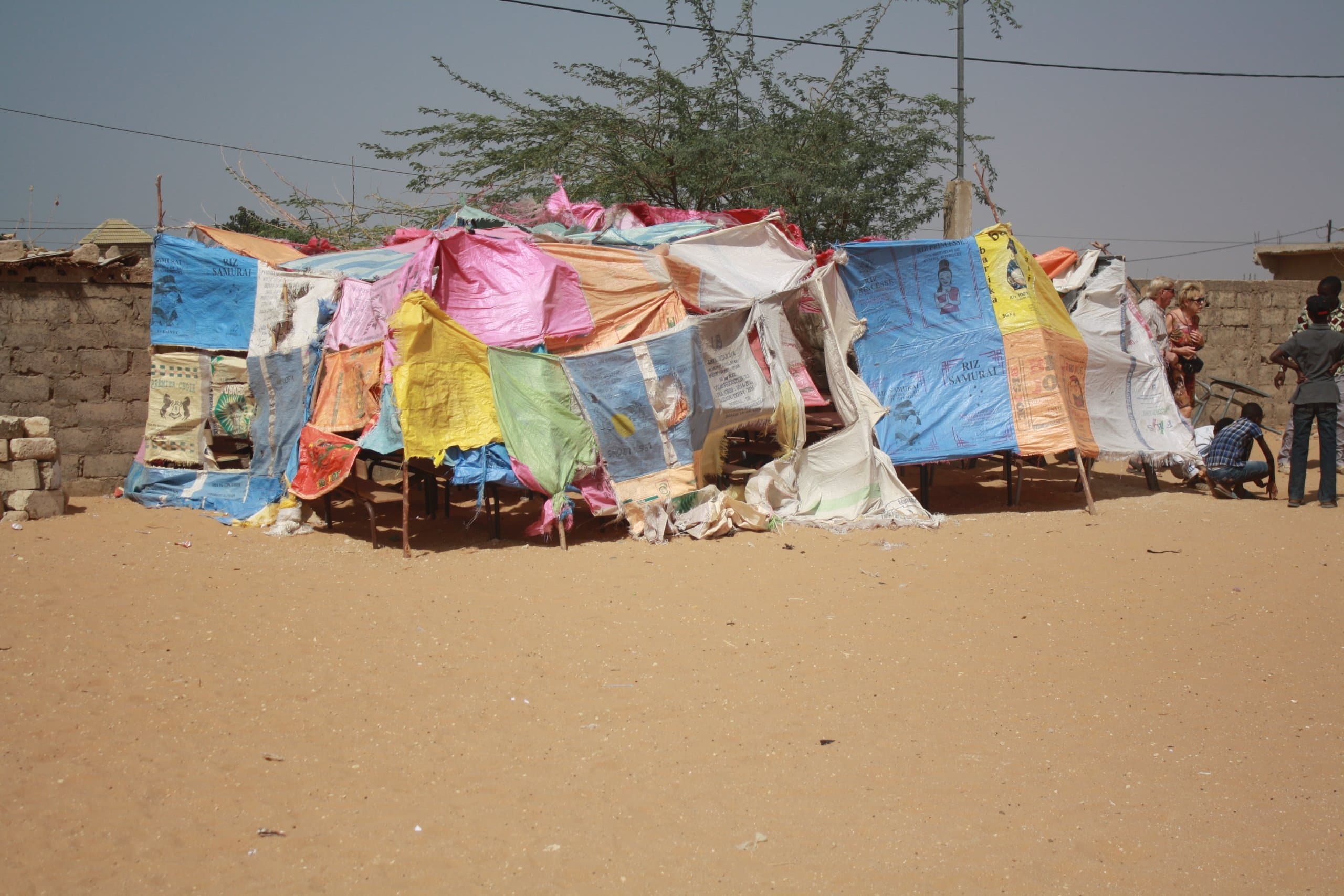 The original makeshift tent classroom, with walls made from stitched-together plastic rice sacks
