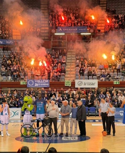 Ceremony in the basketball arena with a bike on the court