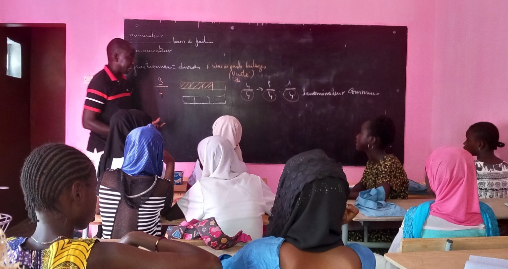 Maths tutoring session at the blackboard